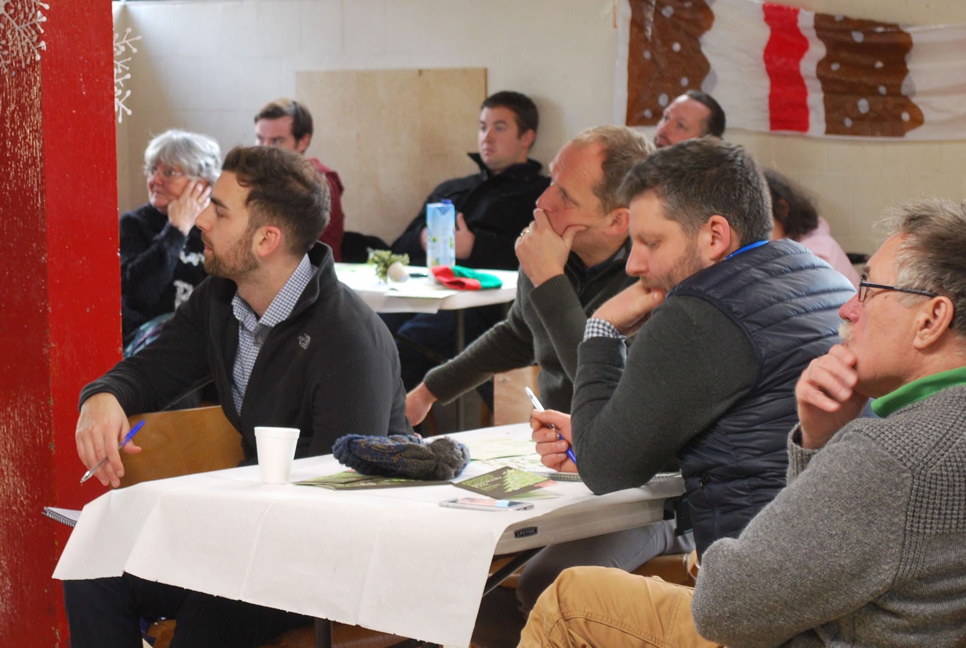 an audience listening to a presentation